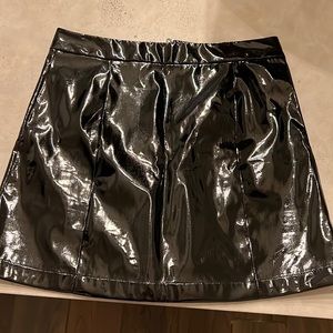 Guess pleather mini skirt fits true to size. Worn once. Mint condition